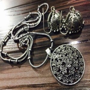 Round Floral German Silver Pendant With Jhumkas