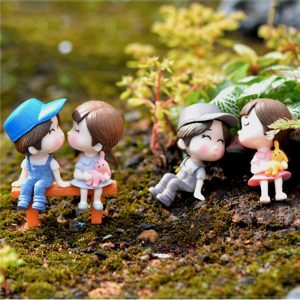 Miniature Cute Boy and Girl On A Bench