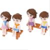 Miniature Cute Boy And Girl Sitting On A Bench