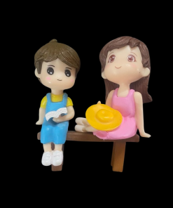 Miniature Boy And Girl Sitting In Bench